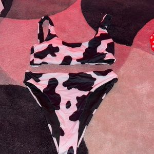 Black and white cow print small bathing suit.